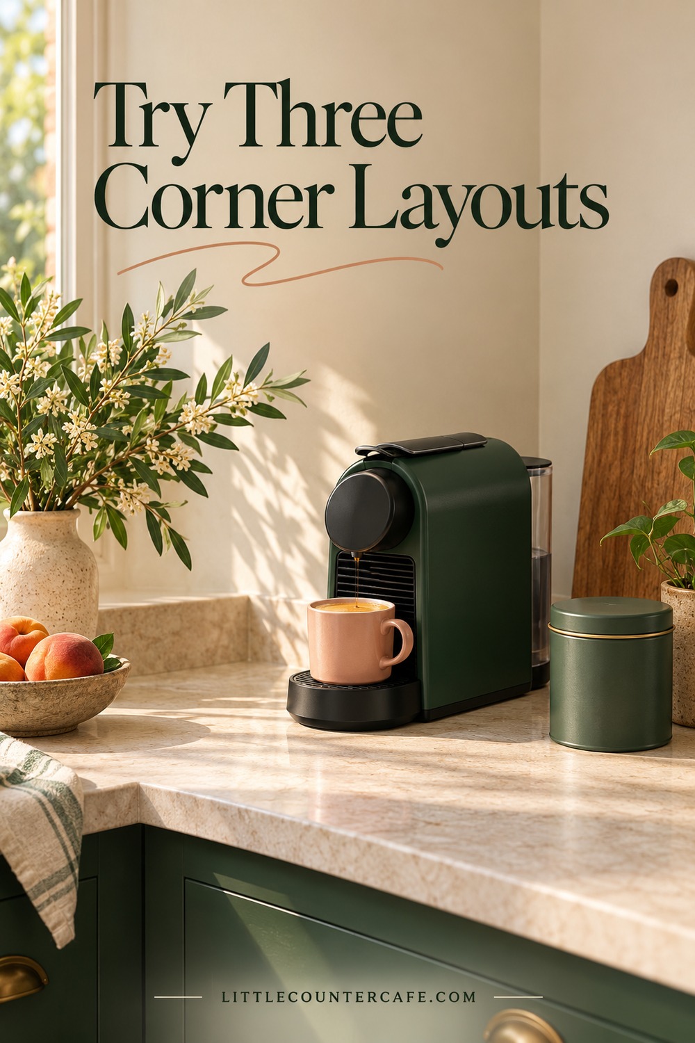 A green capsule coffee maker positioned diagonally on a cream counter beside a closed green tin and peach mug.