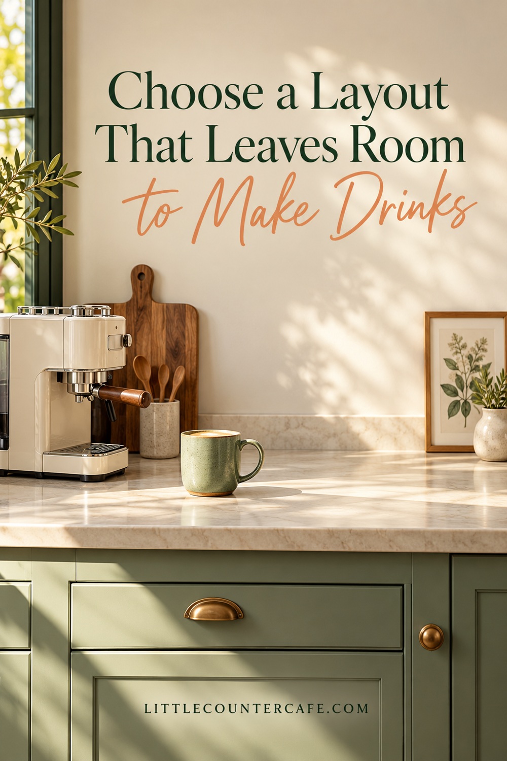 Cream coffee machine at one end of a counter with open space between a sage cup and a small botanical print.